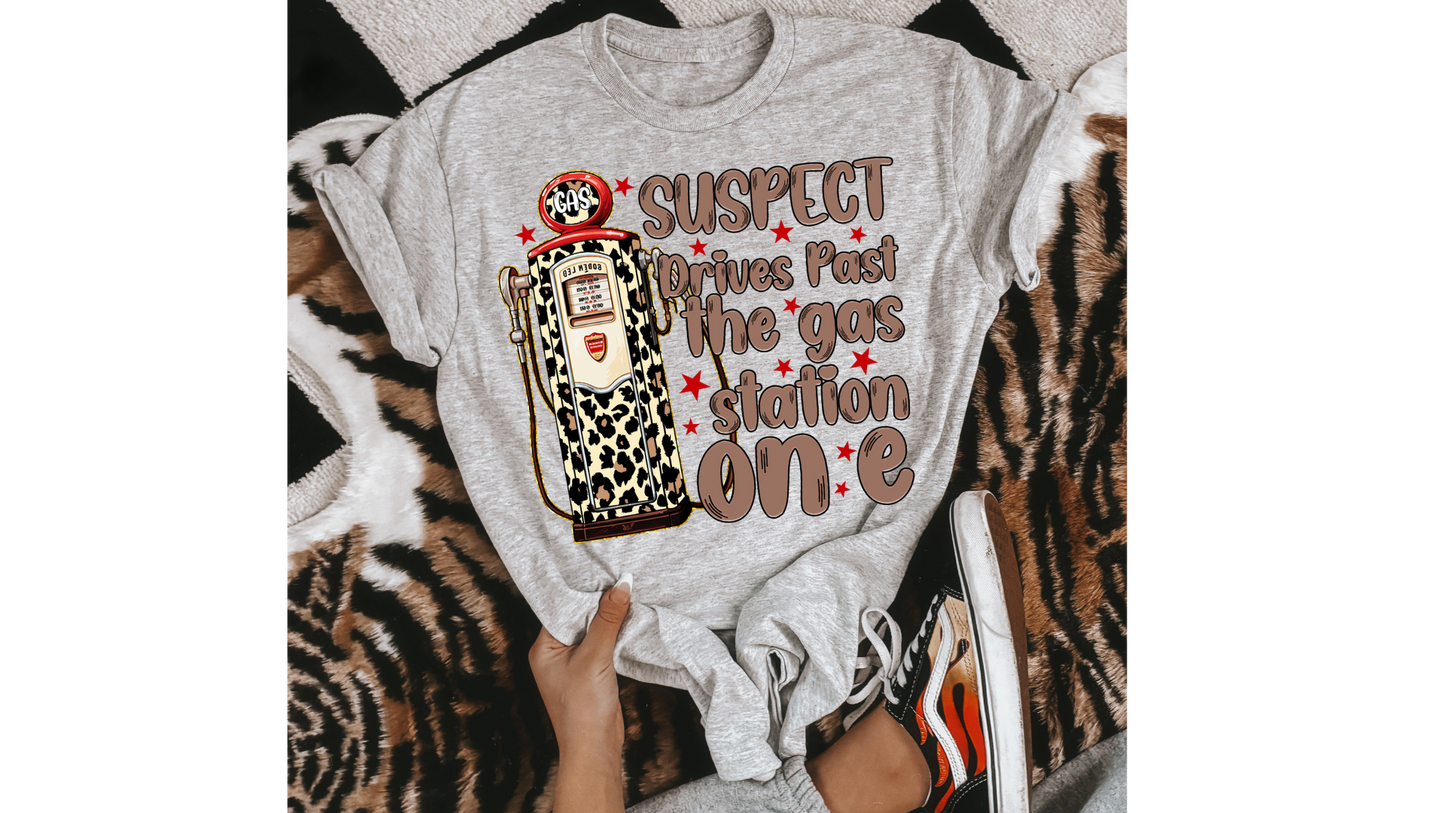 SUSPECT DRIVES PAST GAS STATION