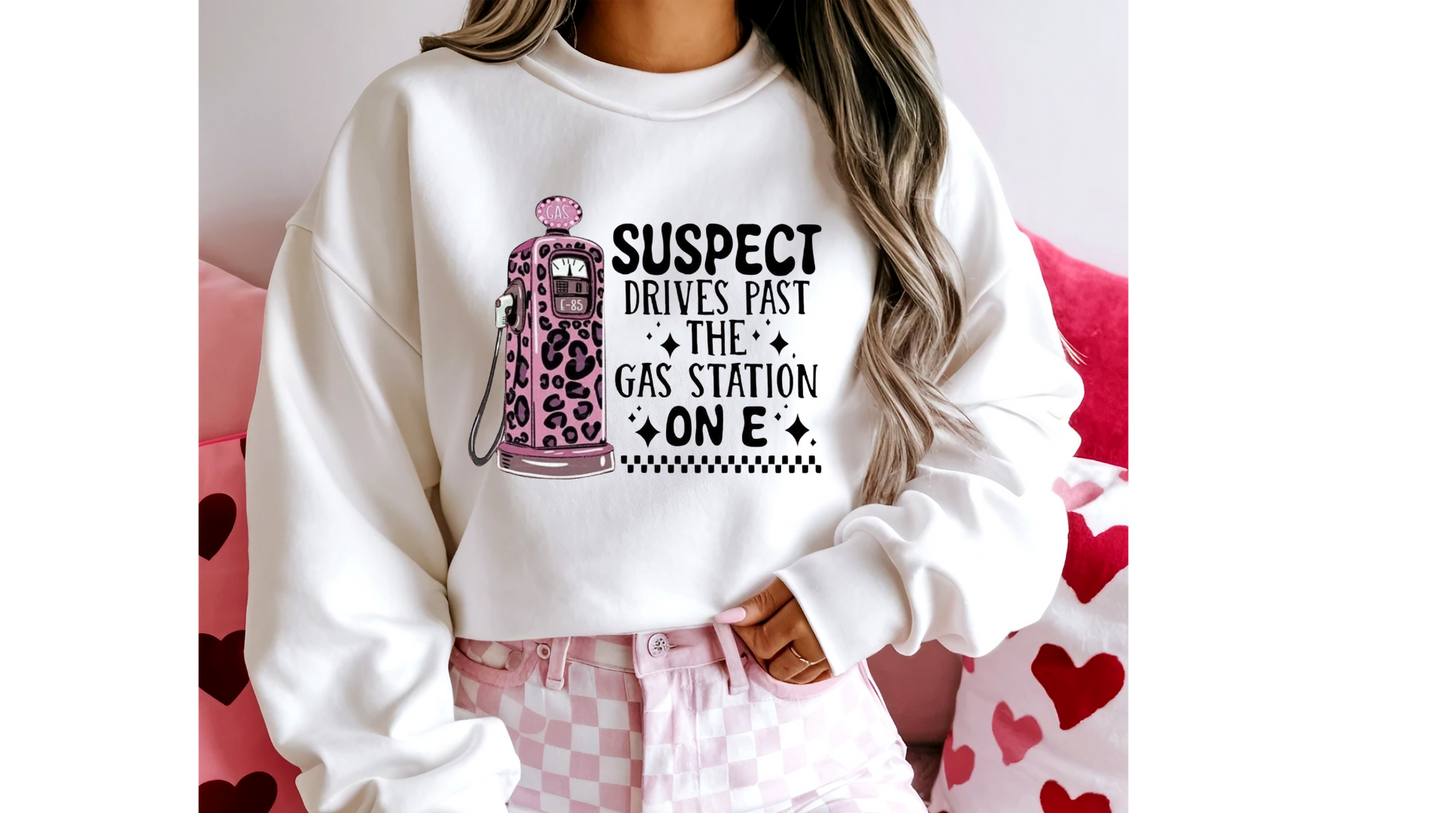 SUSPECT DRIVES PAST GAS STATION ON E