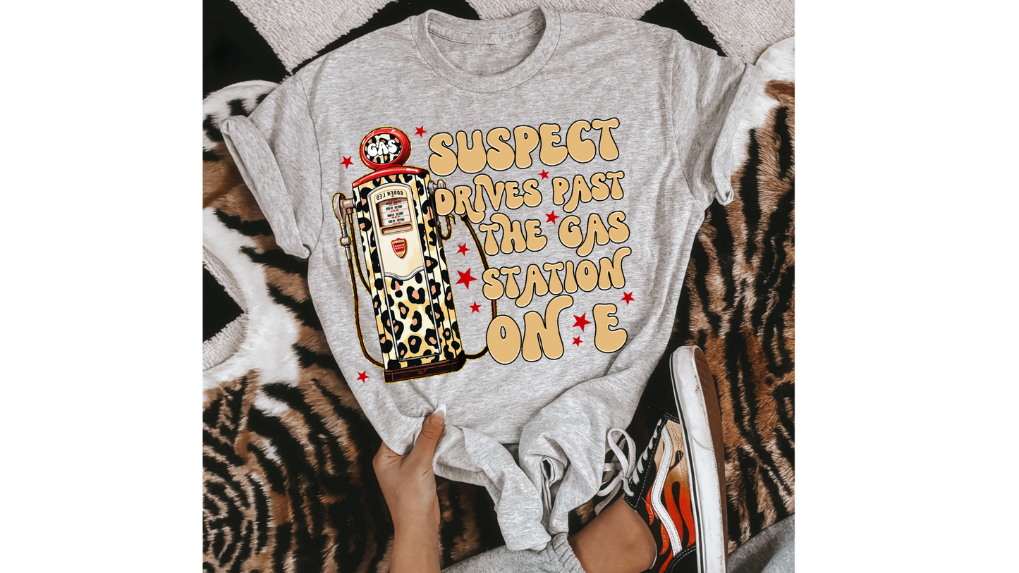 SUSPECT DRIVES PAST GAS STATION YELLOW